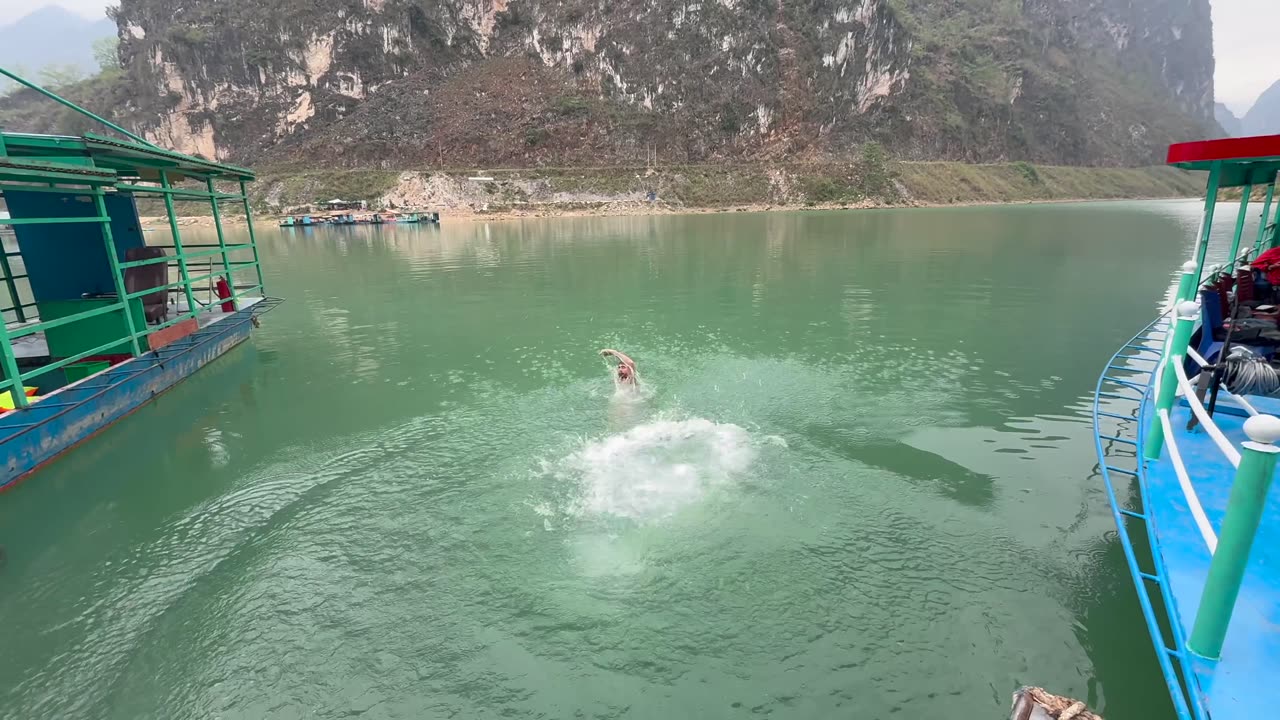Swimming in the Sang Nho Que river along the Ha Giang Loop in Vietnam