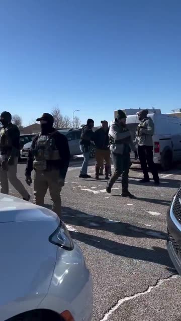 Ian Austin who stormed the church being arrested by the FBI.