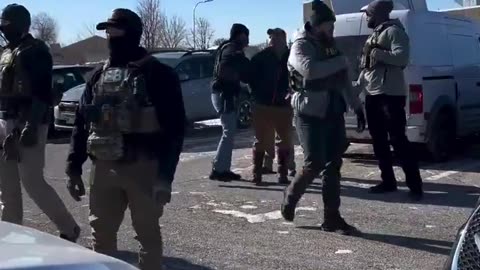 Ian Austin who stormed the church being arrested by the FBI.