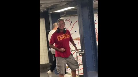 A man wearing a “Hot Girls for Zohran Mamdani” shirt