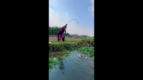 Village Woman Hook Fishing In Canal