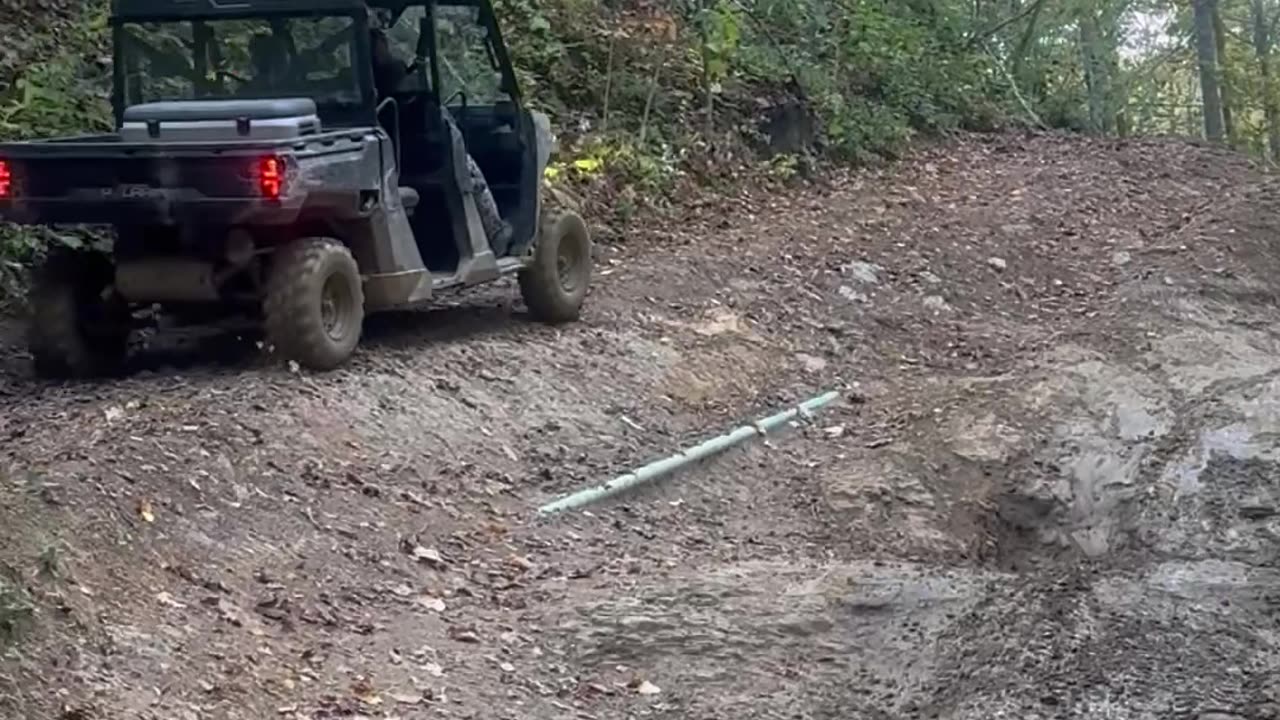 Trail Sodas Spill From Tipped Side-By-Side