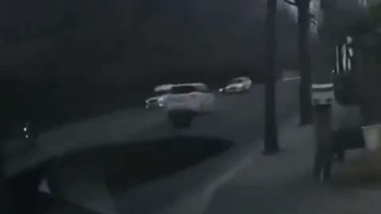 A motorcyclist was swallowed by a hole about 20 meters (65 feet) deep and 20 meters wide