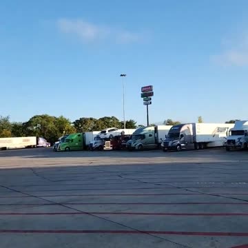 On the phone in truckstop bathroom