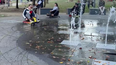Go-Karts Zig Zag Through a Fountain