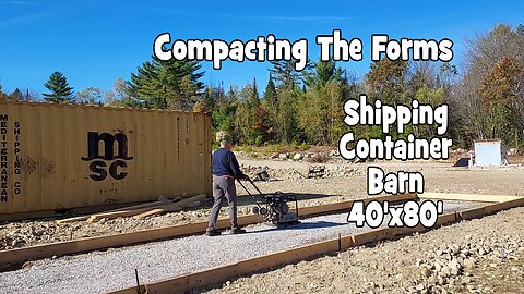 The shipping container barn forms near completion.