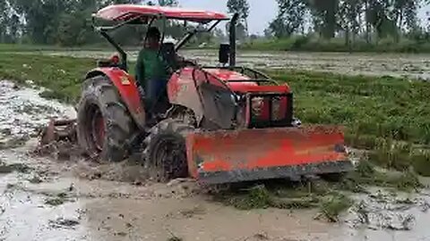 Kubota M6040SU Tractors VS Muddy Field