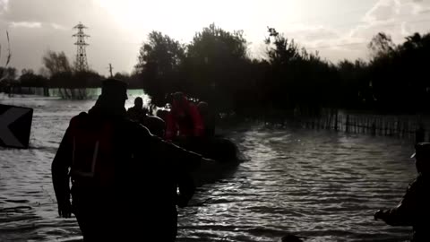 Rescuers use boats to help victims of severe flooding in Albania