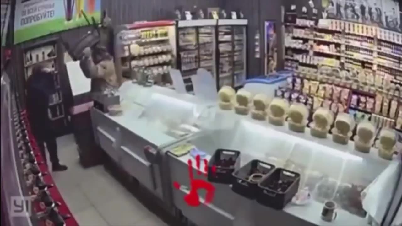 Shop owner and customer take out the bad guy.