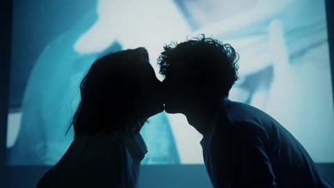 Silhouette Of A Couple Kissing