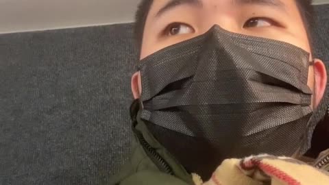 This Me Wearing a Black Mask on A Q58 CityBus in the back seat