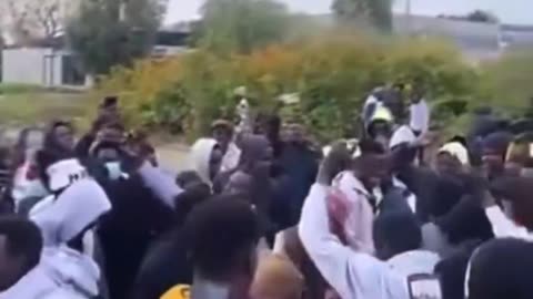 Fake asylum seekers dance with French women while waiting for dinghy trips to UK.