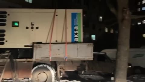 In Dnipro, mobile generators are being brought directly to houses to power high-rise buildings