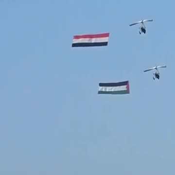 Paragliders flew Egyptian and Palestinian flags...