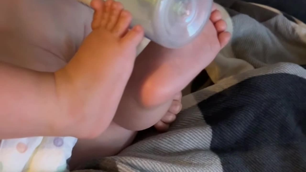 Bottle Boy Holds Bottle With His Feet