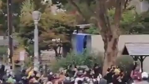 masked federal agents indiscriminately shoot peaceful protester