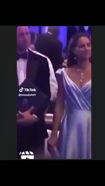 What in the world is moving around under her dress? It's alive...