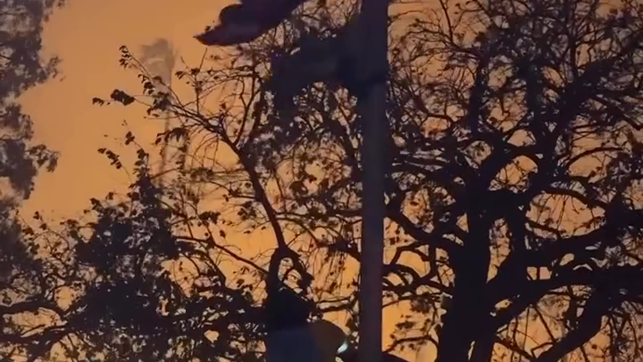 Firefighter scales flag pole to save American flag from nearby flames