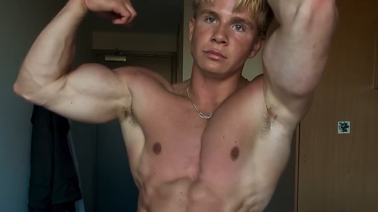 Young man flexing muscles