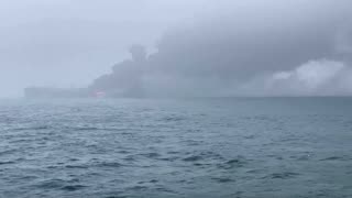 Fire and smoke rise after tanker collision off UK coast