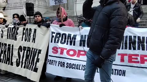 Andre Easton, a teacher, protests against Donald Trump and ICE.