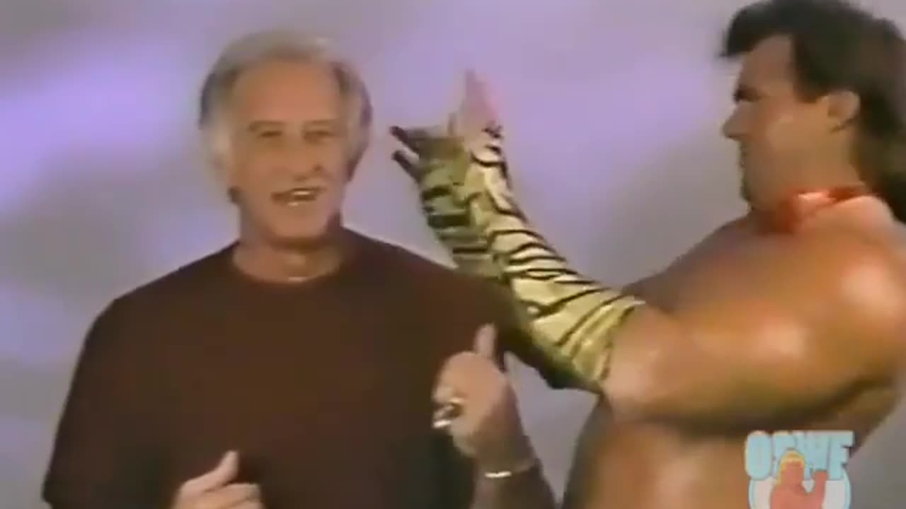 That's Brutus the Barber Beefcake giving a hair cut