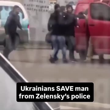 Ukrainian citizens rush to save a man from police nabbing males off the street to fight in war