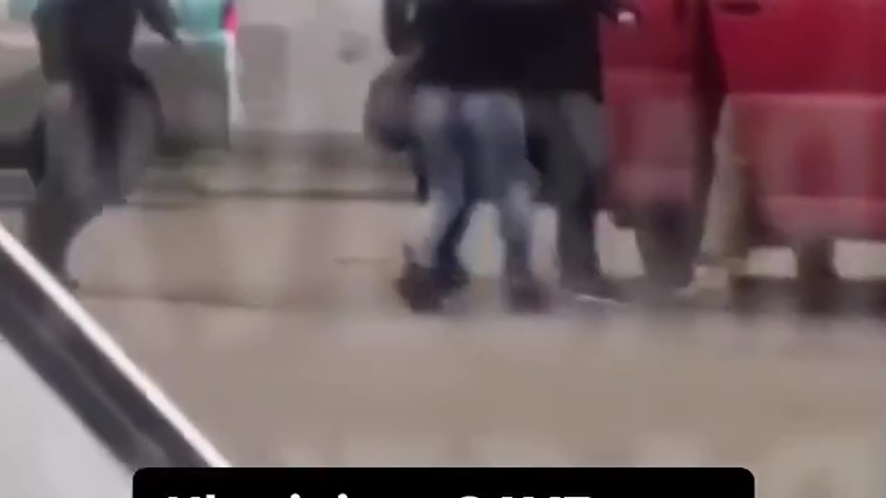 Ukrainian citizens rush to save a man from police nabbing males off the street to fight in war