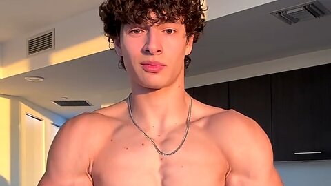 Young man flexing muscles