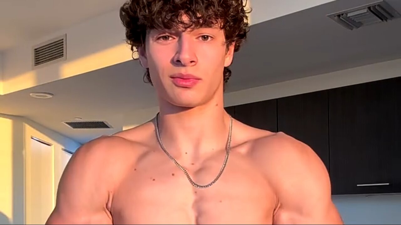 Young man flexing muscles