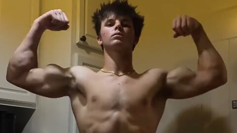 Young bodybuilder flexing muscles