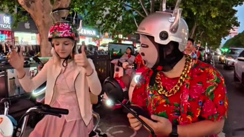 Even without a helmet, European girl gets lectured by officer