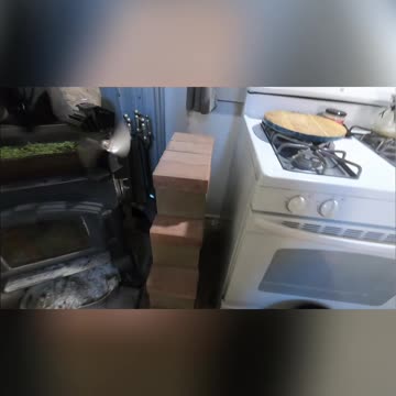 Cabin Life_ Efficient Wood Stove & Gravity Feed System Explained! #livingoffgrid