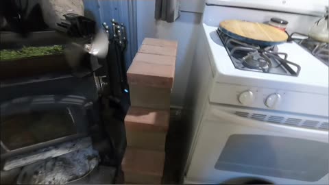 Cabin Life_ Efficient Wood Stove & Gravity Feed System Explained! #livingoffgrid