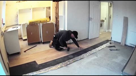 The first few rows of laminate from the hallway into the living room