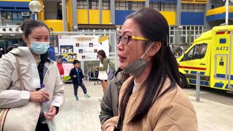 Hong Kong police make arrests as firefighters search for survivors