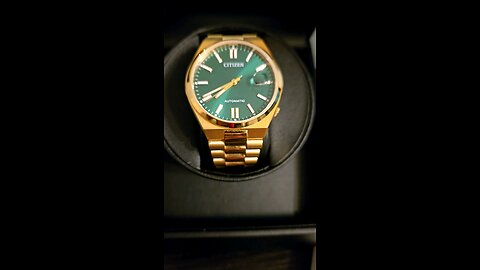 my prized one is the Citizen gold automatic green dial watch ⌚️