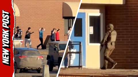 Students evacuate with hands raised following Canada's deadliest school shooting in 40 years
