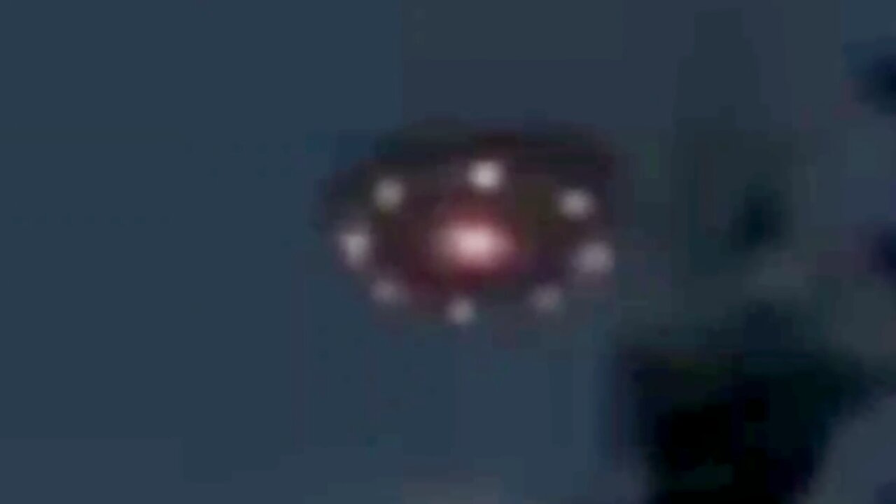 Large UFO Moves Behind Trees