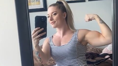 Beautiful muscular woman flexing muscles