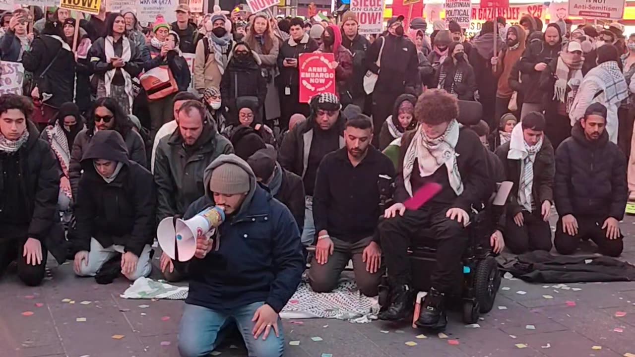 Muslims praying and supporting Palestine in Times Square.