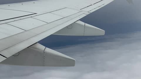 Southwest 737 departure in rain, window seat view