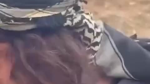 A Palestinian child stands bravely against settler attacks in the West Bank