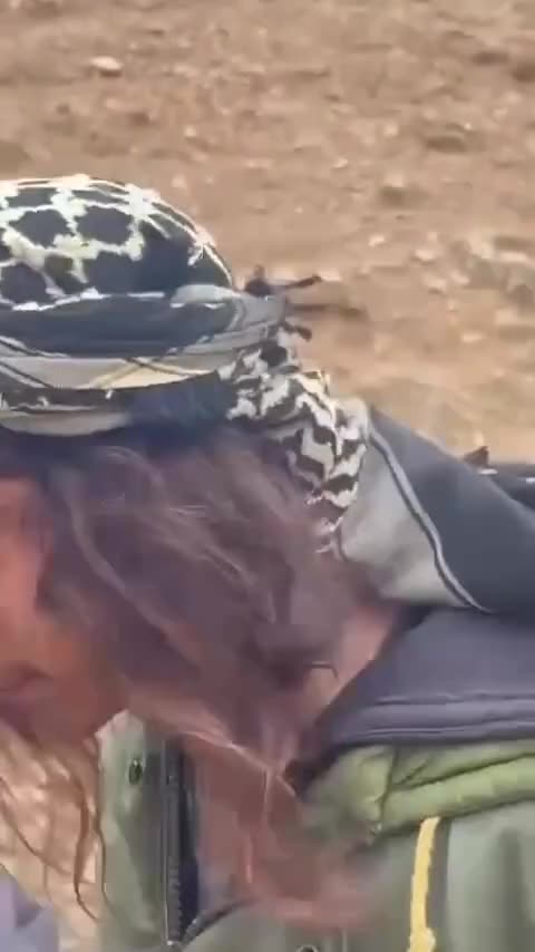 A Palestinian child stands bravely against settler attacks in the West Bank