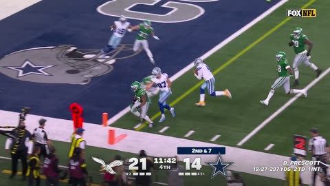 Dallas Cowboys QB Dak Prescott dives over Philadelphia Eagles defenders for the TD
