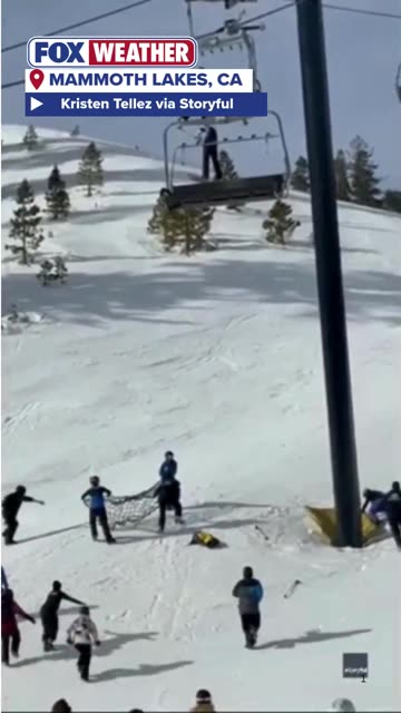 Footage shows a snowboarder dangling from a ski lift at Mammoth Mountain Ski Area in California
