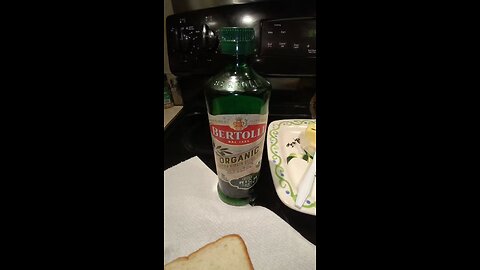 Eating Bertolli Organic Extra Virgin Olive Oil, Dbn, MI, New Year's Day 2025