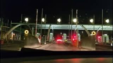 M6 Toll Road Southbound, UK, Through the plaza at night.