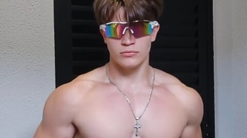18 years old teen boy flexing muscles
