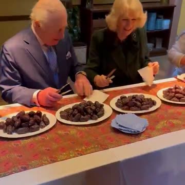 Charles and Camilla help package dates for Muslims to eat as the first food to